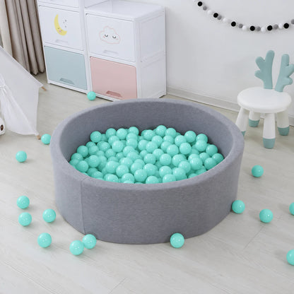 Grey kids’ ball pool filled with mint green 8cm soft plastic ball pit balls