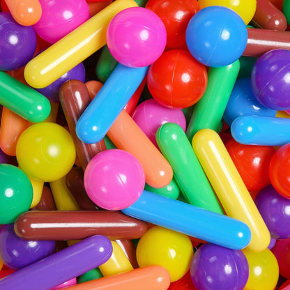 Close-up of multicolour cylinder pieces and round ball pit balls